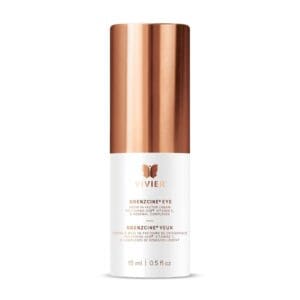 Luxury skincare serum with copper-toned cap in sleek white bottle.