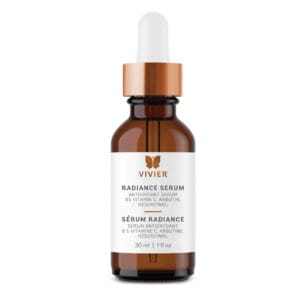 Amber dropper bottle with skincare serum and white label.