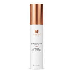 White skincare bottle with copper cap and minimalistic design.