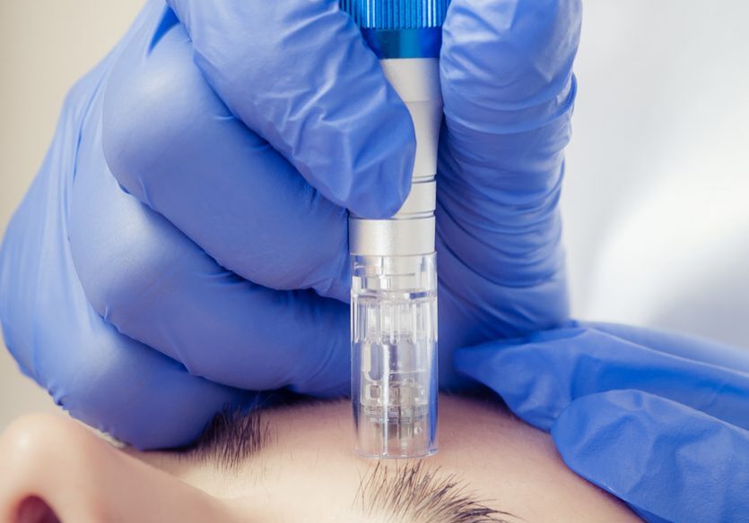 Young woman getting a cosmetic medicine treatment at beauty salon. Skin care